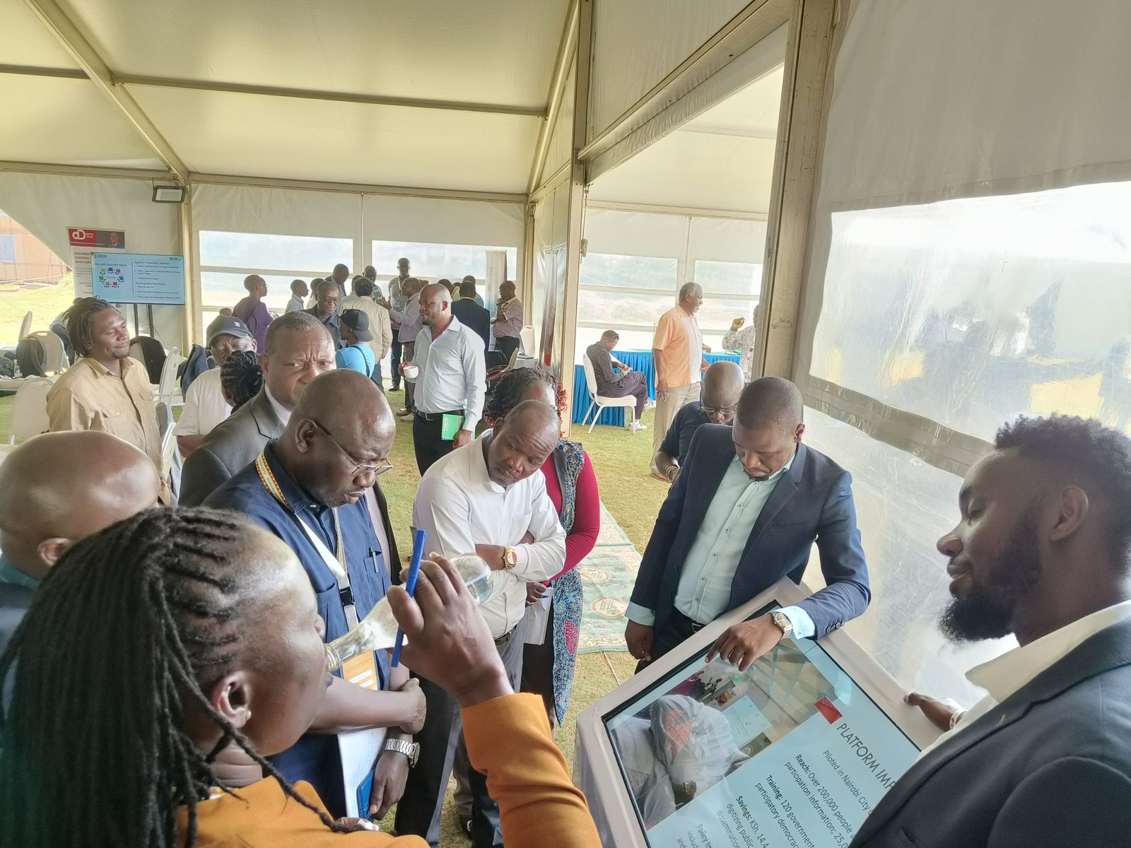 Officials engaging with a Civic Voices platform demonstration at a stakeholder forum